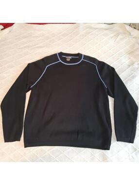 This is a black cotton sweater with light blue piping and a "Pandemonium" tag.